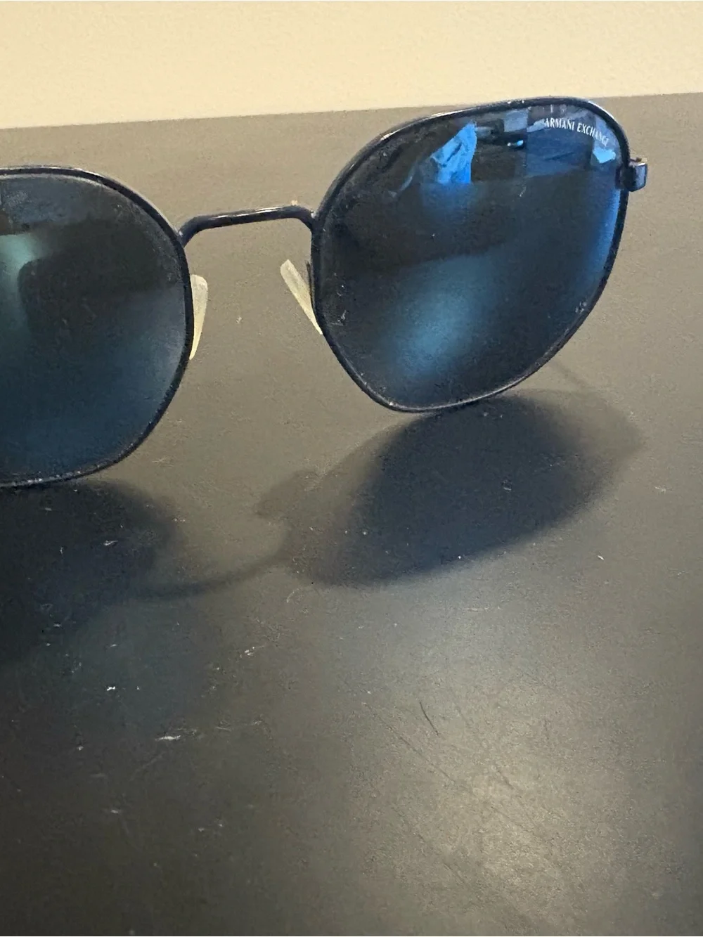 Armani Exchange Black Frame Sunglasses with Blue Lenses